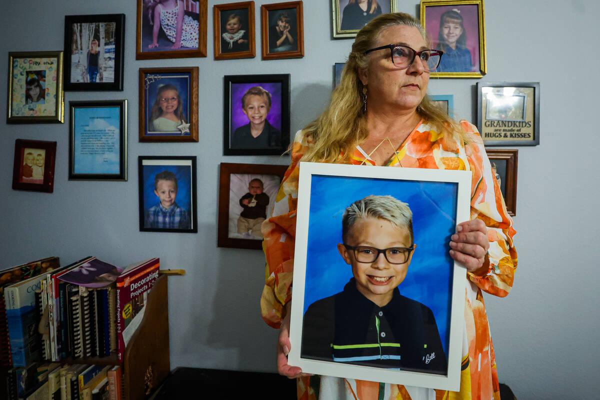 Suzan Smith poses with a photograph of her son, Jonny Smith, 12, who was killed by a speeding d ...