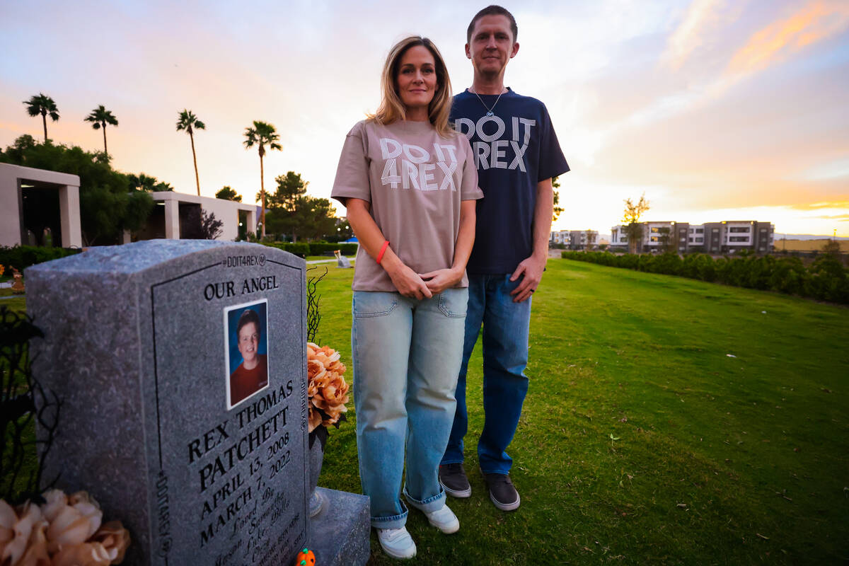 Samantha, left, and Jason Patchett stand for a portrait at the grave of their son, Rex Patchett ...