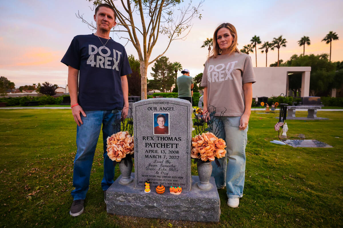 Jason, left, and Samantha Patchett stand for a portrait at the grave of their son, Rex Patchett ...