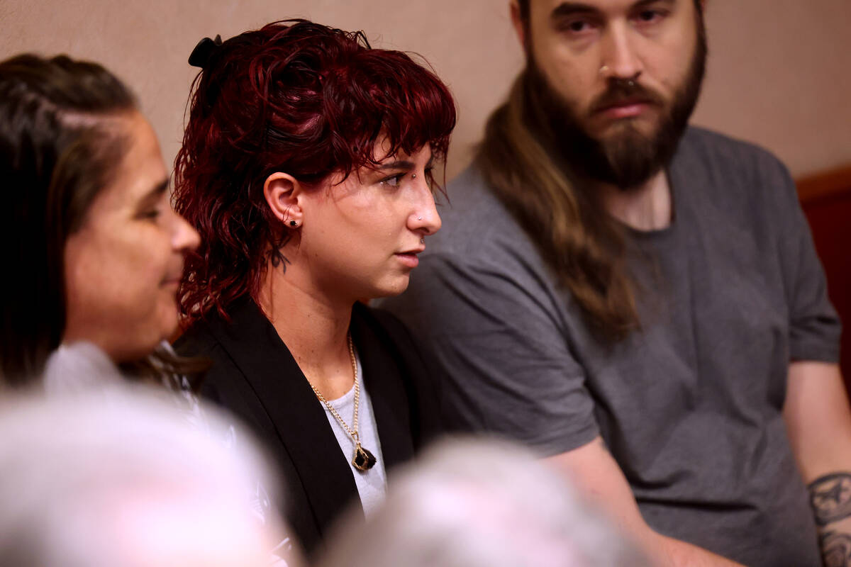 Ren Leone-LaCroix, an alleged victim of Nathan Chasing Horse, center, talks to prosecutor Willi ...