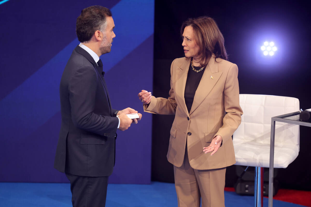 Vice President Kamala Harris talks with Noticias Univision anchor Enrique Acevedo during a comm ...