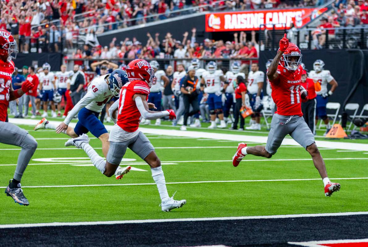 UNLV wide receiver Ricky White III (11) scores a touchdown off a blocked punt on the Fresno Sta ...