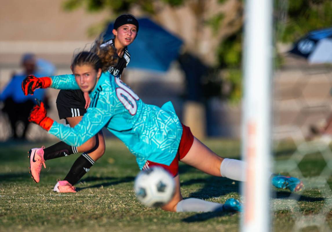 Palo Verde forward Olivia Gastwirth (4) scores on Liberty goalkeeper Brooke Kramer (00) during ...