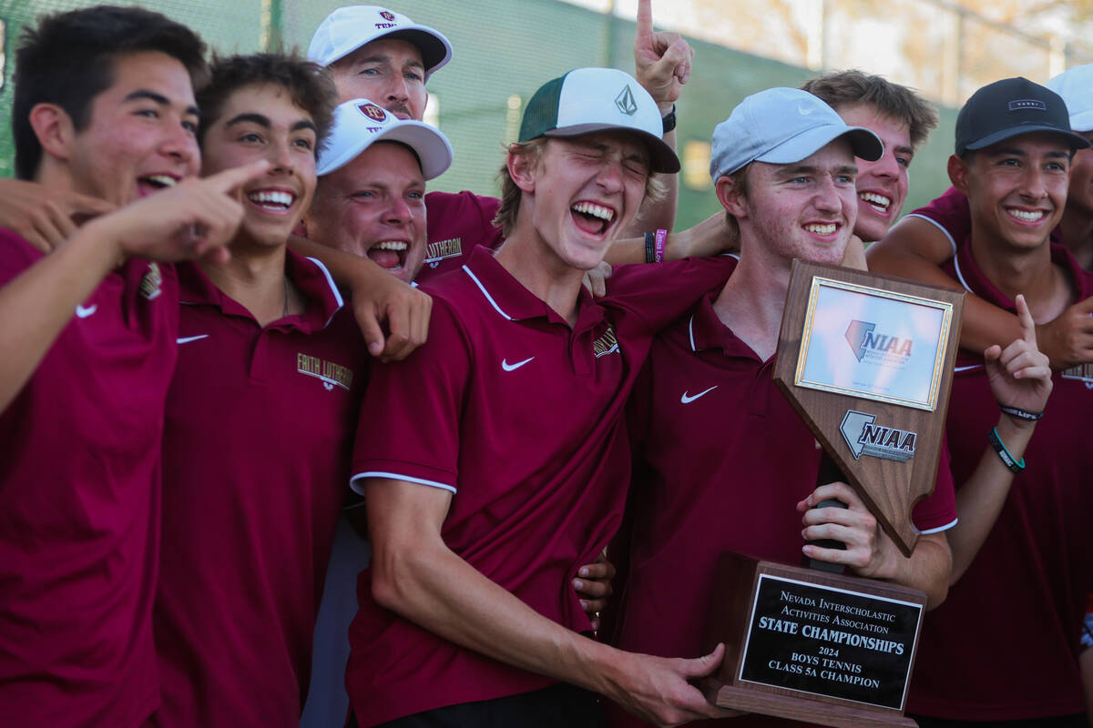 Faith Lutheran teammates celebrate during a 5A high school boys tennis state championships matc ...