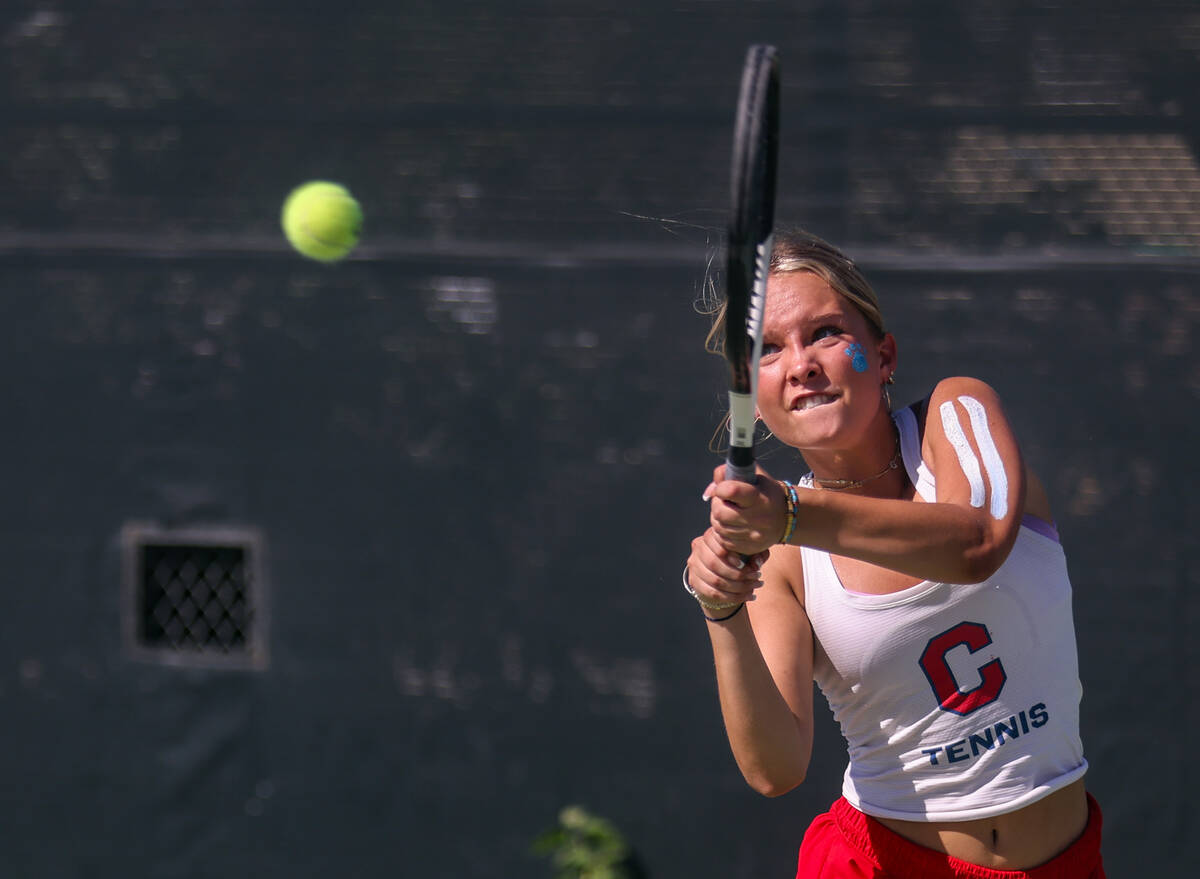 Coronado High School’s Gigi Smart swings to return the ball during a match against Palo ...