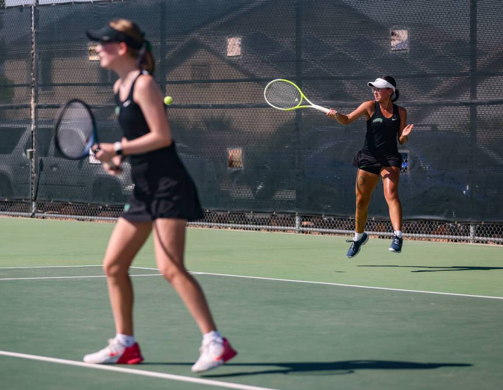 Palo Verde High School’s Layla Zamani serves the ball with doubles partner Evelyn Vernet ...