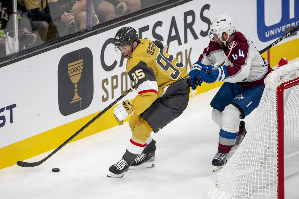 Vegas Golden Knights right wing Victor Olofsson (95) keeps the puck from Colorado Avalanche def ...