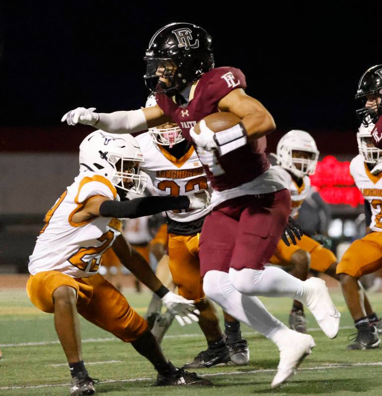 Faith Lutheran's wide receiver Rouselle Shepard (4) runs with the ball against Legacy High duri ...