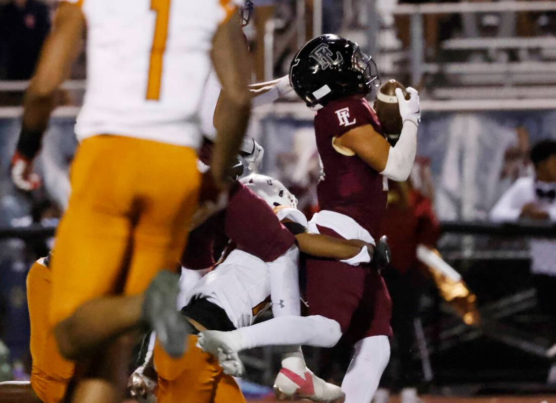 Faith Lutheran's wide receiver Rouselle Shepard (4) catches the ball during the second half of ...