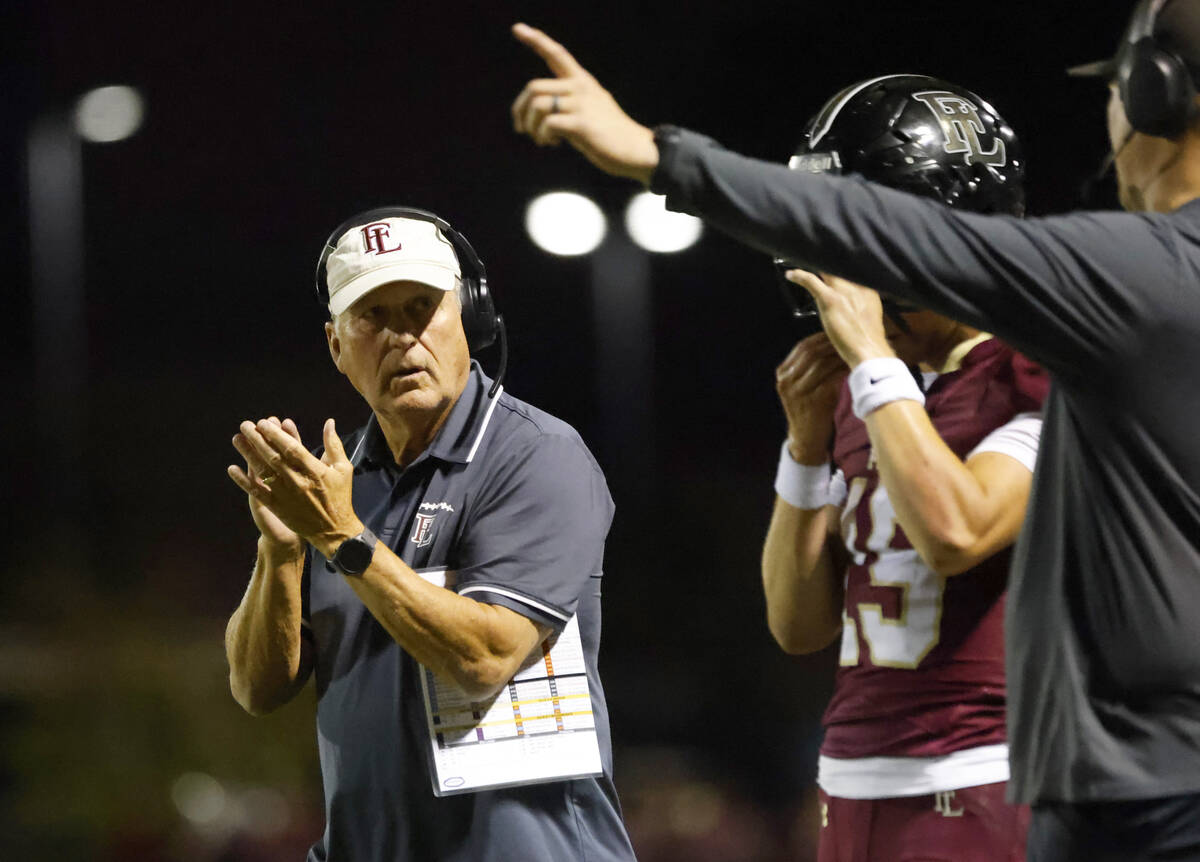 Faith Lutheran High head coach Mike Sanford reacts to a play from the sidelines during the firs ...