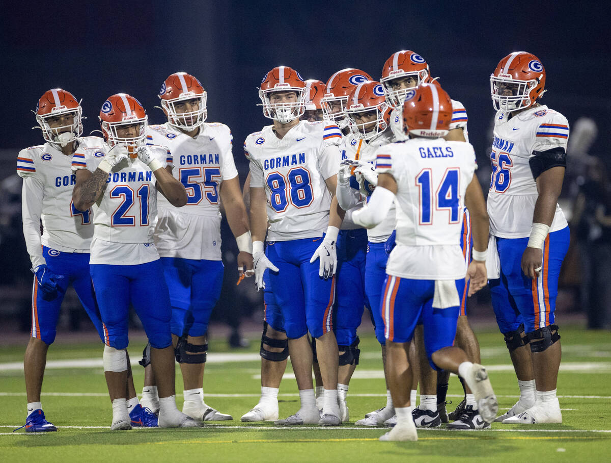 The Bishop Gorman offense waits for Bishop Gorman quarterback Maika Eugenio (14) to give the pl ...