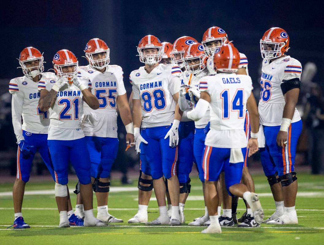 The Bishop Gorman offense waits for Bishop Gorman quarterback Maika Eugenio (14) to give the pl ...