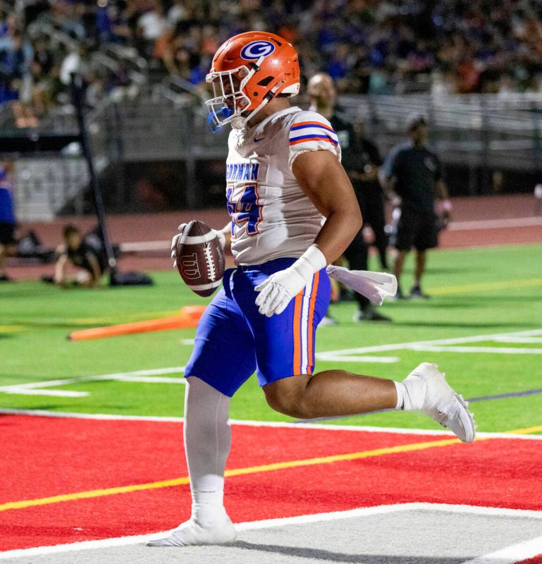 Bishop Gorman defensive lineman Sione Motuapuaka (44) scores a touchdown during the high school ...