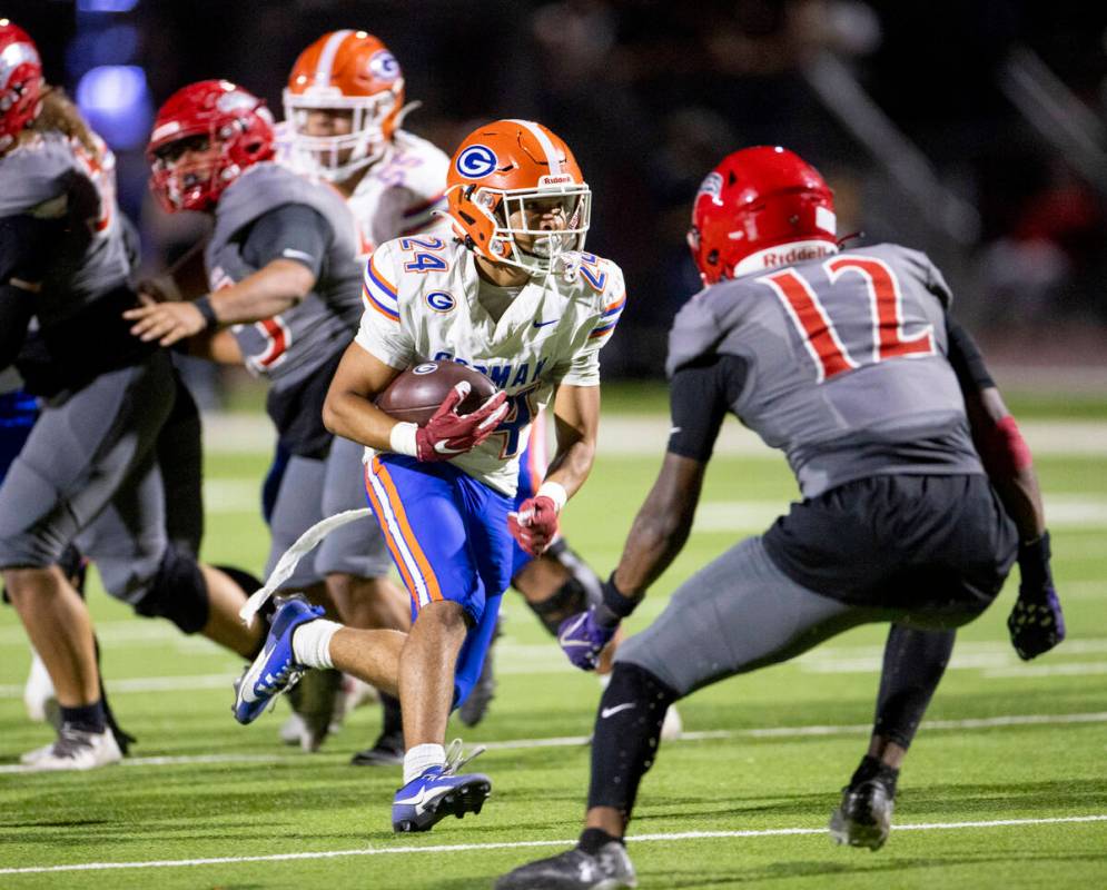 Bishop Gorman running back Myles Norman (24) runs the ball during the high school football game ...