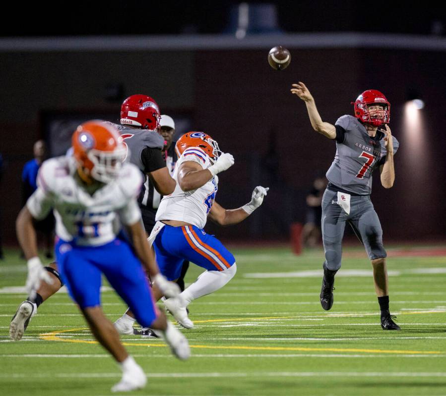 Arbor View quarterback Thaddeus Thatcher (7) throws the ball during the high school football ga ...