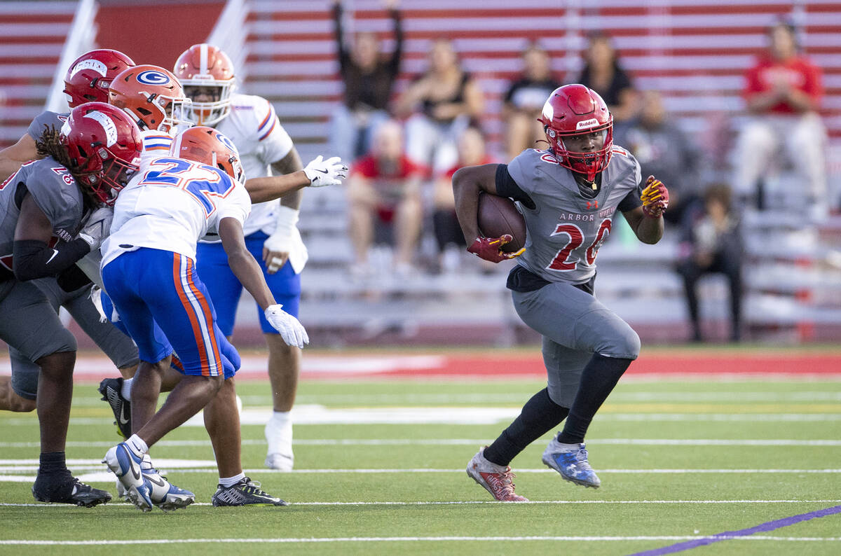 Arbor View running back Kaine Berry (26) runs with the ball during the high school football gam ...