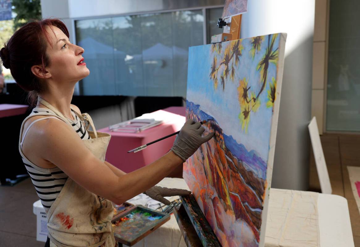 Andrea Knox with the First Friday Foundation does live painting during Summerlin Festival of Ar ...