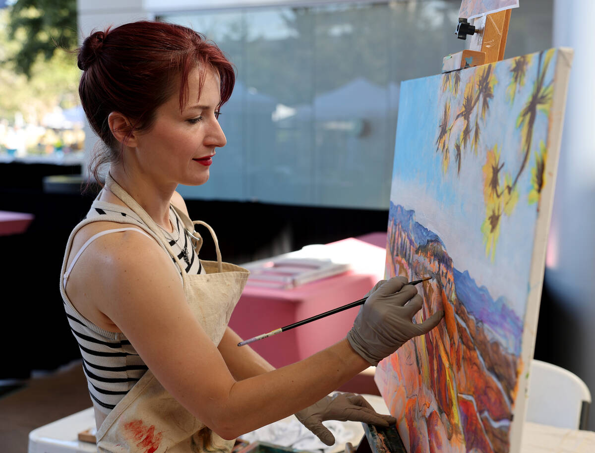 Andrea Knox with the First Friday Foundation does live painting during Summerlin Festival of Ar ...