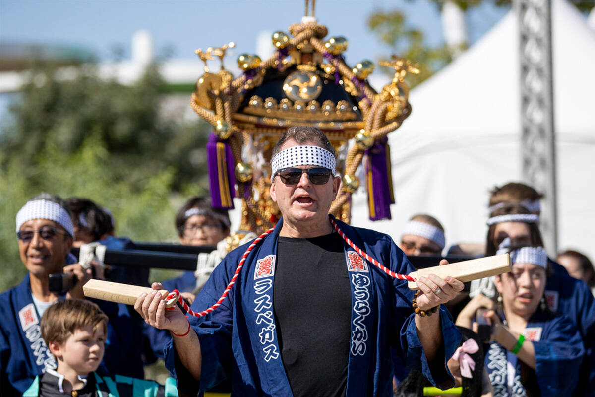 Jason Schuck leads a Mikoshi procession during the Aki Matsuri Japanese Festival at Water Stree ...