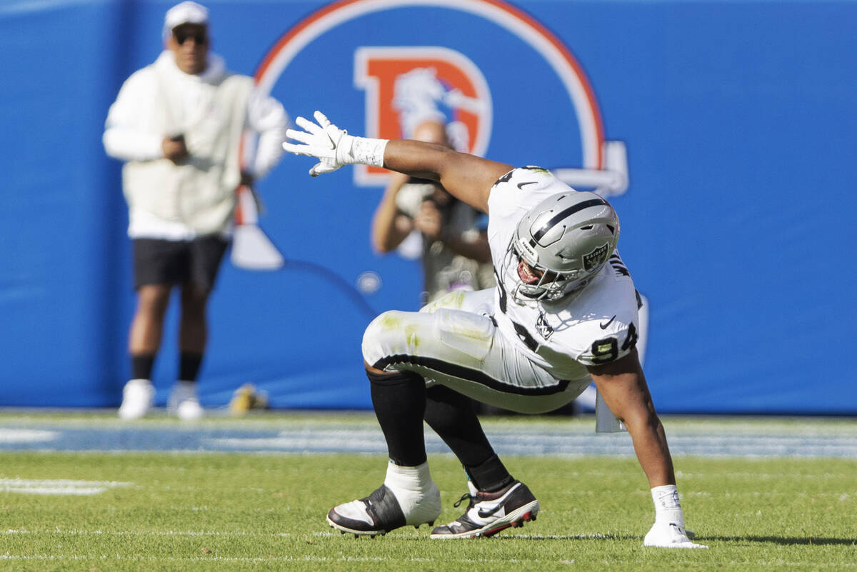 Raiders defensive tackle Christian Wilkins (94) grimaces as he gets up after celebrating a sack ...