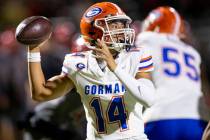 Bishop Gorman quarterback Maika Eugenio (14) looks to throw the ball during the high school foo ...