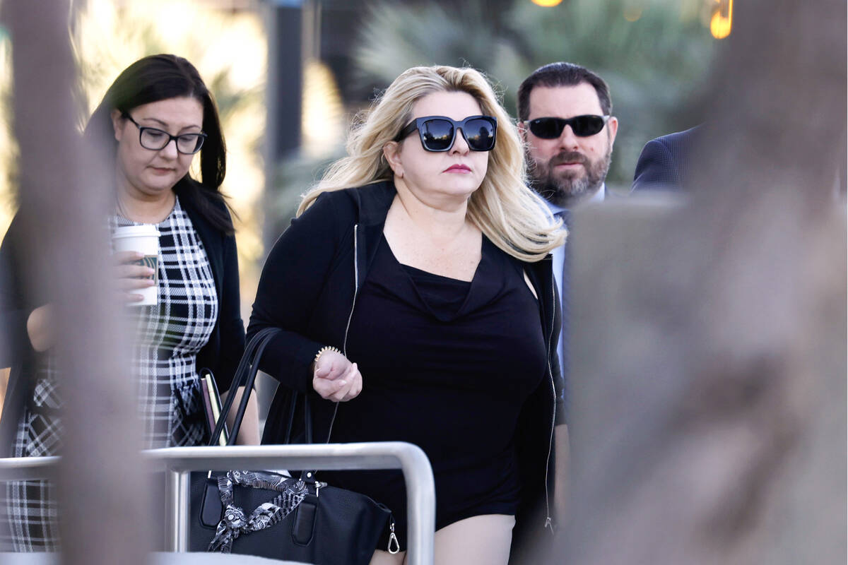 Former Las Vegas City Councilwoman Michele Fiore, center, arrives for her wire fraud trial at t ...