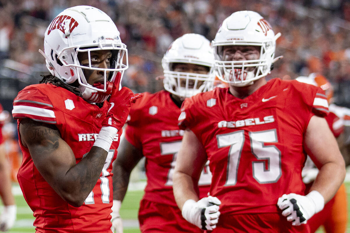 UNLV wide receiver Ricky White III (11) celebrates after scoring a touchdown during the college ...