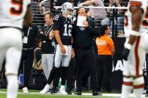 Raiders head coach Antonio Pierce speaks to quarterback Aidan O'Connell (12) on the sidelines d ...