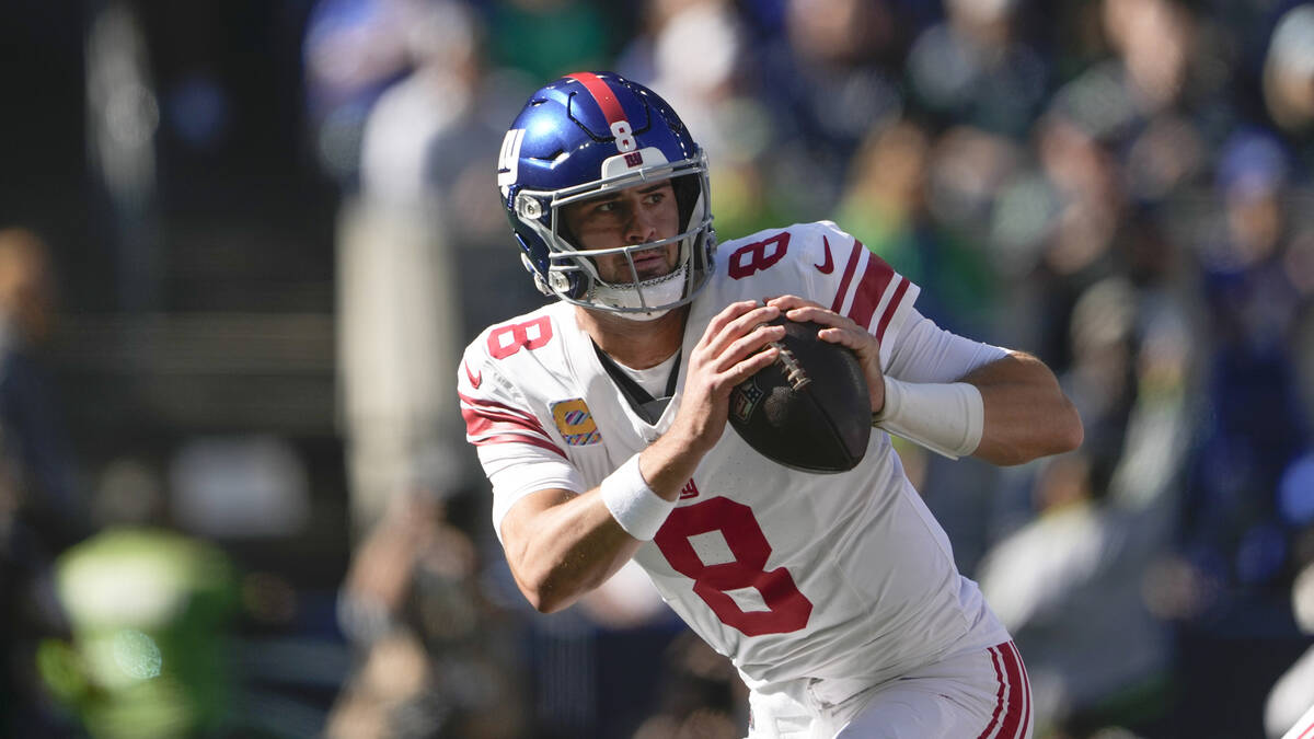 New York Giants quarterback Daniel Jones runs with the ball against the Seattle Seahawks during ...