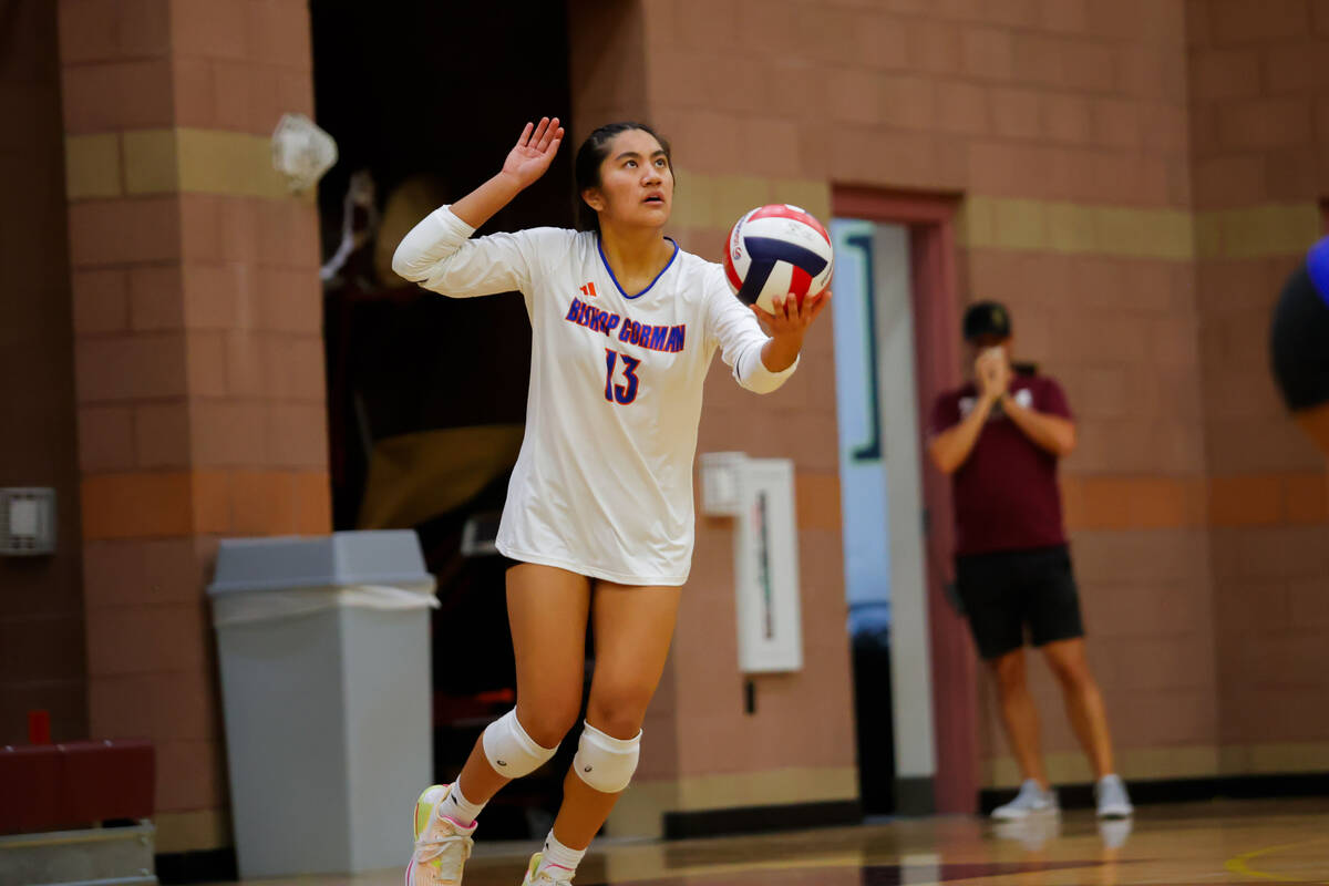 Bishop Gorman Chloe Lopez (13) serves the ball during a volleyball game between Faith Lutheran ...