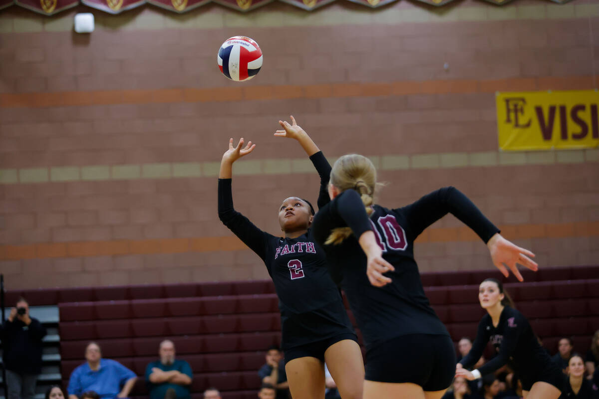 Faith Lutheran’s K Sawyer (2) sets the ball during a volleyball game between Faith Luthe ...