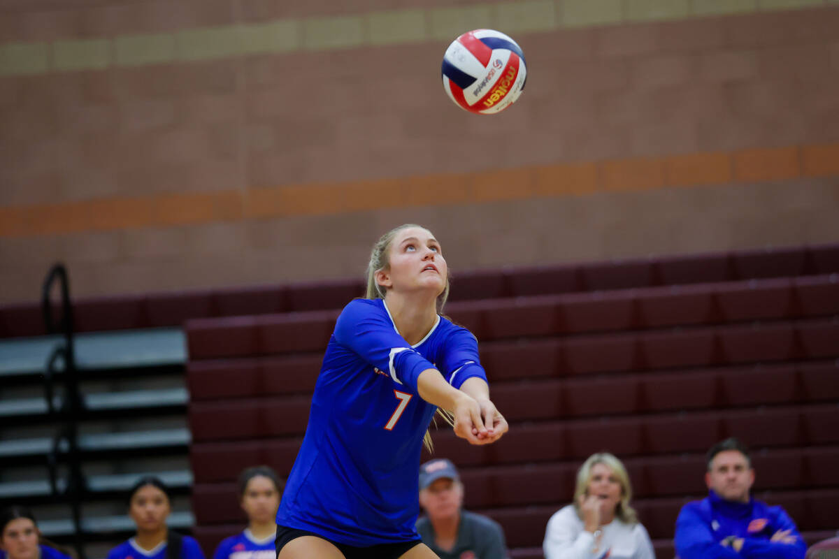 Bishop Gorman Ellie Prindl (7) digs the ball during a volleyball game between Faith Lutheran an ...