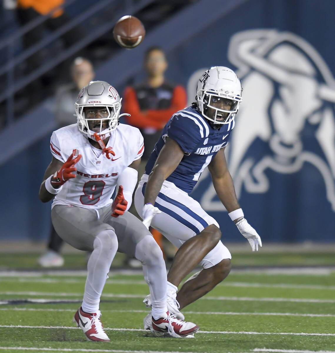 UNLV defensive back Jett Elad (9) intercepts a pass intended for Utah State wide receiver Jalen ...