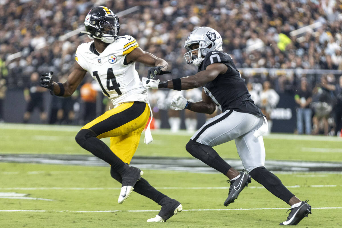 Raiders cornerback Jakorian Bennett (0) defends as Pittsburgh Steelers wide receiver George Pic ...