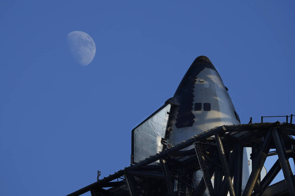 The moon rises over SpaceX's mega rocket Starship as it is prepares for a test launch Saturday, ...