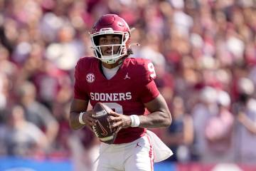 Oklahoma quarterback Michael Hawkins Jr. (9) looks to throw a pass in the first half of an NCAA ...