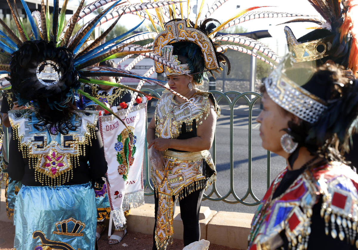 Members of the Danza Tonantzi Guadalupana Las Vegas dance group, including Arcely Metina, cente ...