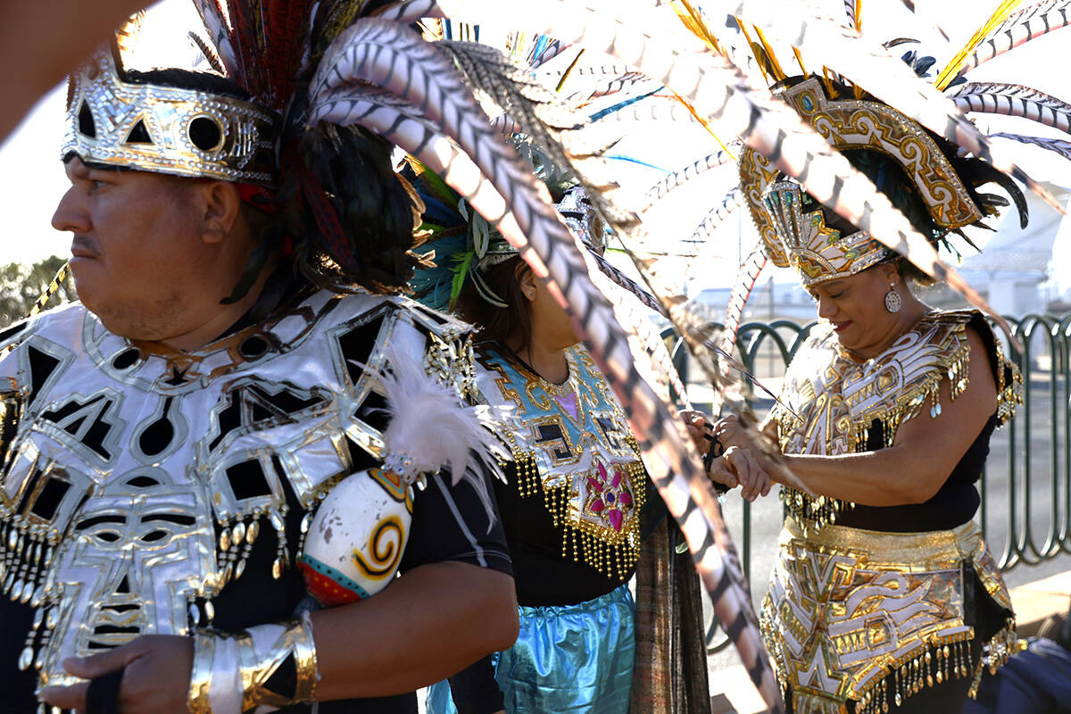 Members of the Danza Tonantzi Guadalupana Las Vegas dance group, including Beda Quintana, cente ...