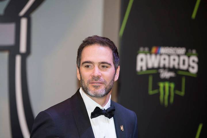 Jimmie Johnson takes photos during the Fan Red Carpet on Thursday, Nov. 29, 2018, at Wynn Las V ...