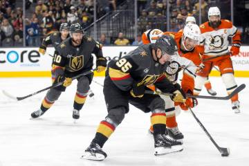 Golden Knights right wing Victor Olofsson (95) and Anaheim Ducks center Isac Lundestrom (21) co ...