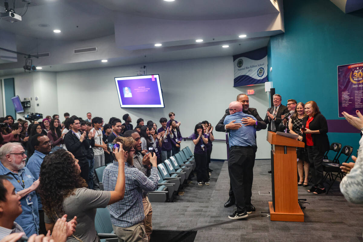 Principal Anthony Marentic embraces math teacher Mike Patterson, who won 2025 Nevada State Teac ...