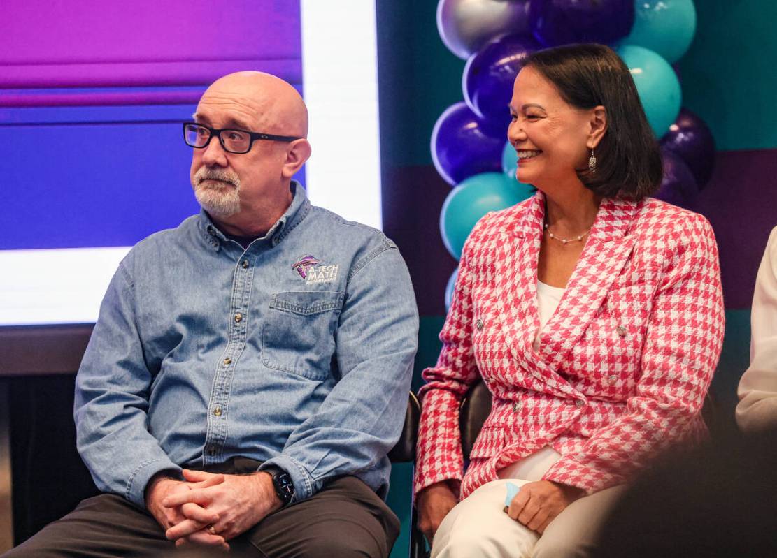 Math teacher Mike Patterson, sitting next to Superintendent of Public Instruction Jhone Ebert, ...