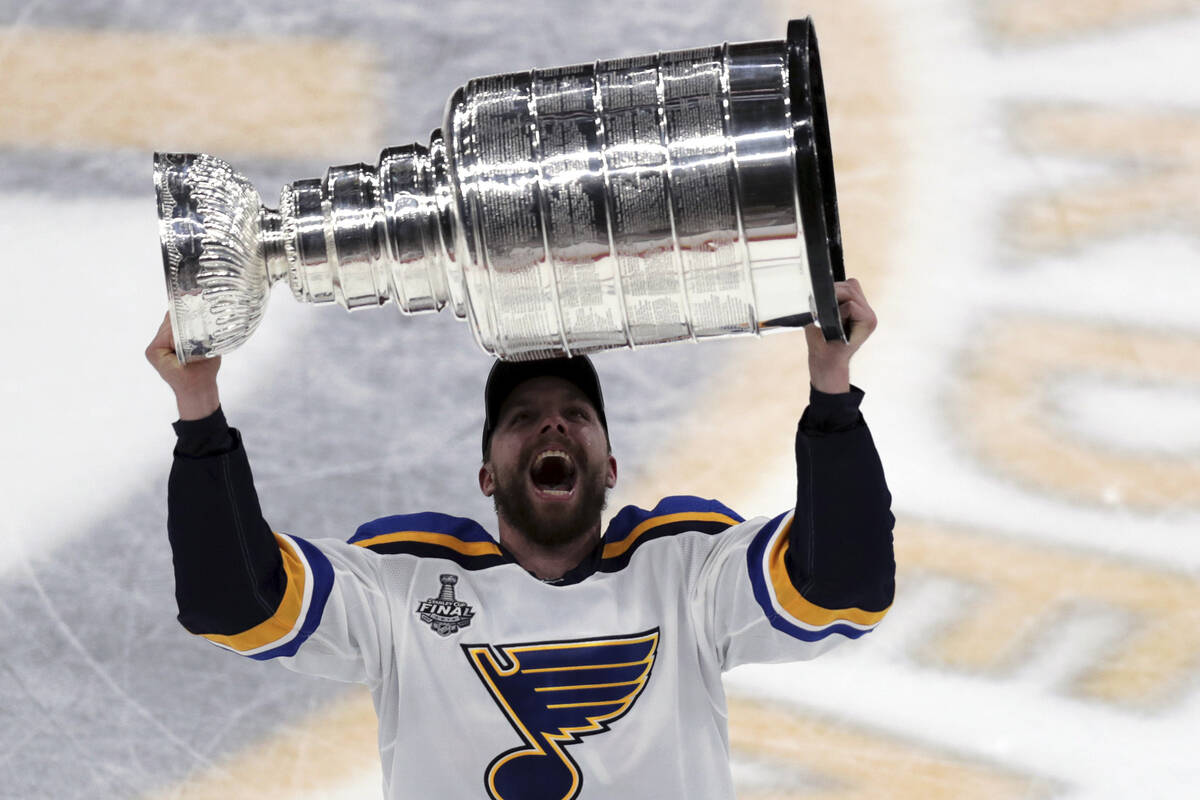 St. Louis Blues' David Perron carries the Stanley Cup after the Blues defeated the Boston Bruin ...