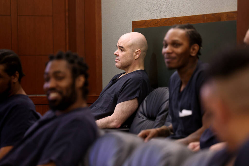 Robert Telles, center, waits in the courtroom before a hearing at the Regional Justice Center i ...