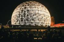 Spectators watch the Sphere on Thursday, July 4, 2024, in Las Vegas. (Madeline Carter/Las Vegas ...