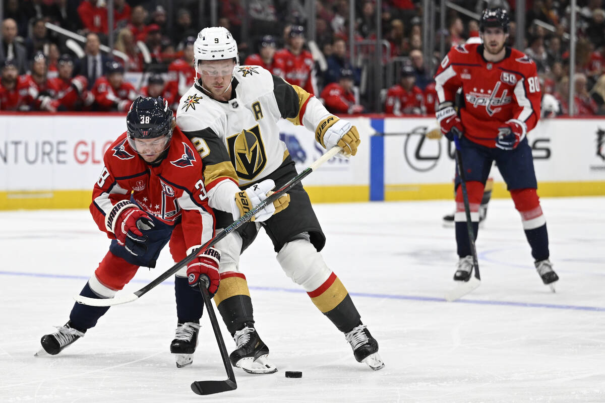 Washington Capitals defenseman Rasmus Sandin, left, and Vegas Golden Knights center Jack Eichel ...