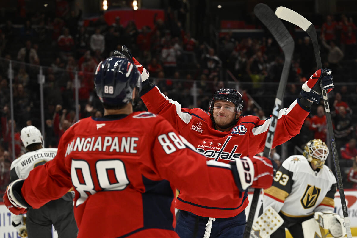 Washington Capitals left wing Jakub Vrana, center, celebrates his goal with Capitals left wing ...