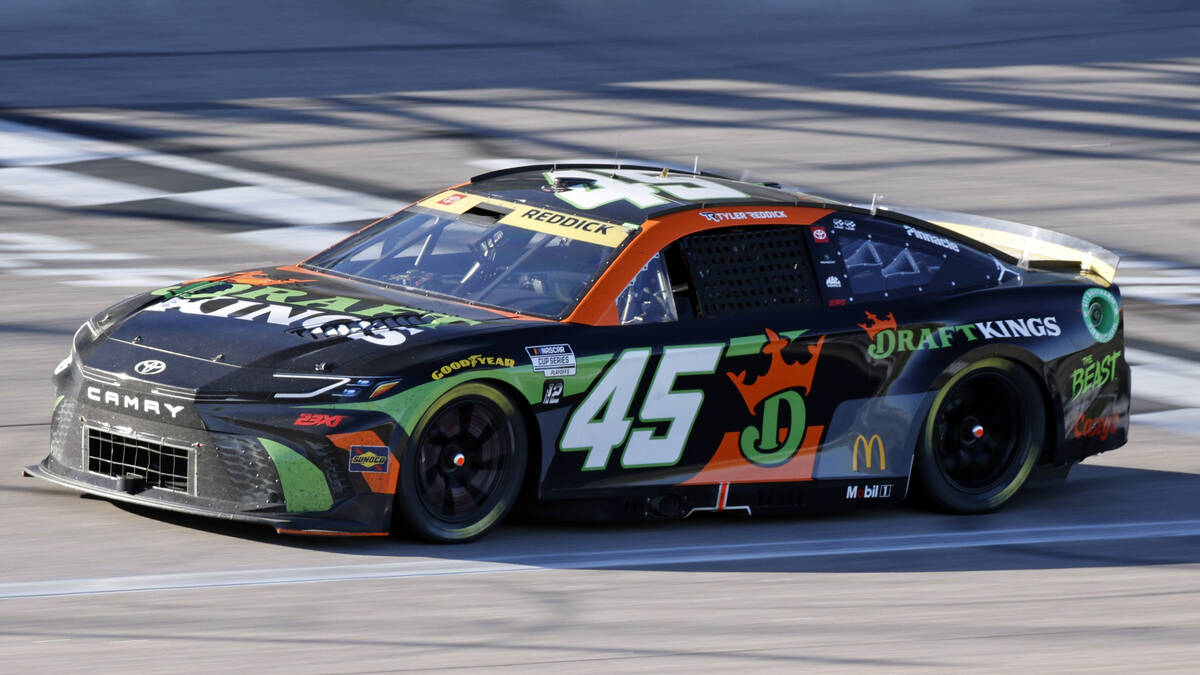 Tyler Reddick (45) heads down the front straightaway during a NASCAR Cup Series auto race at Ka ...