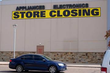 Store closing sign hangs on the outer wall near the entrance to a Conn's appliance store Tuesda ...