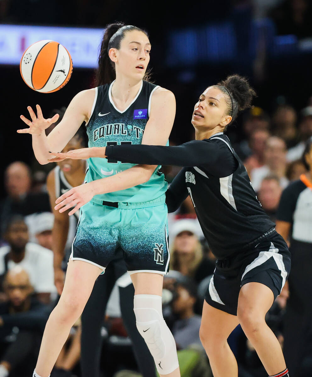 Aces forward Alysha Clark (7) tries to steal the ball from New York Liberty forward Breanna Ste ...